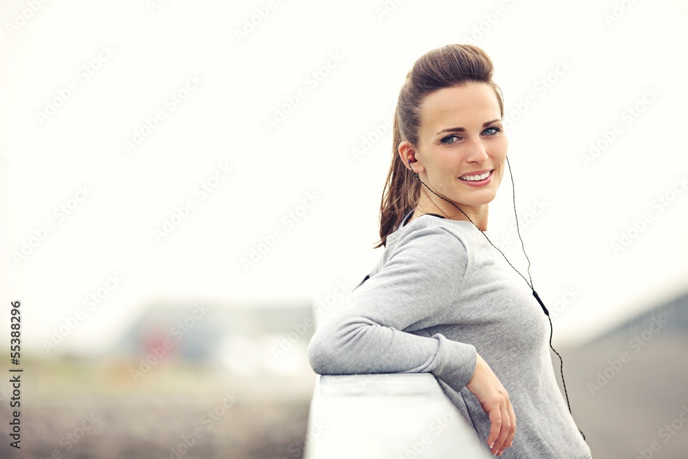 Female Jogger Resting and Looking At You