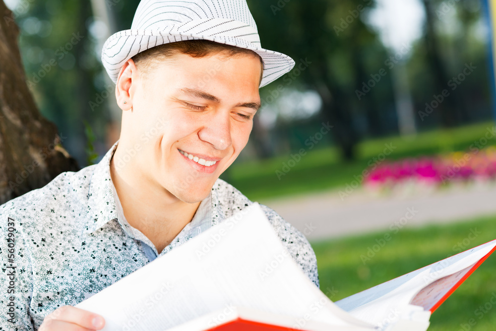 young man reading a book