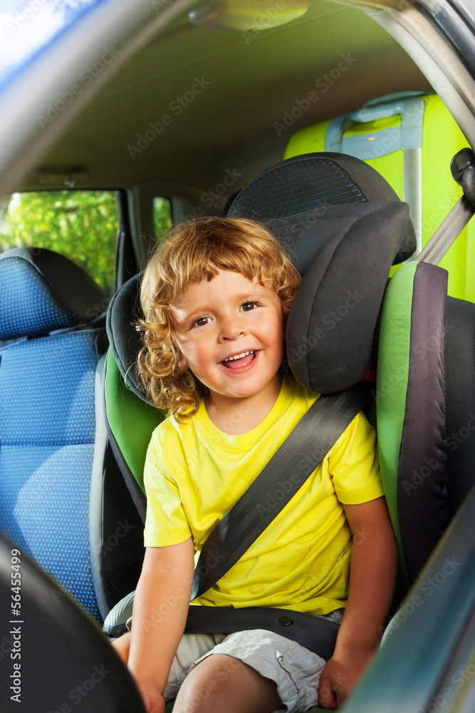 3 years old boy in the back child seat