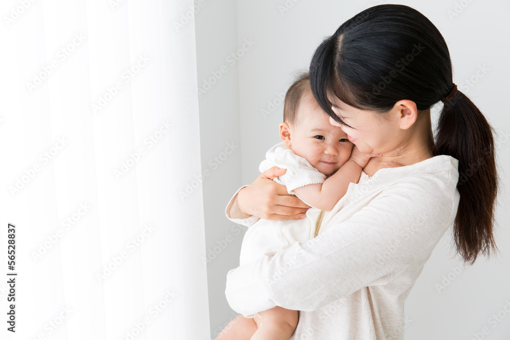 asian baby and mother relaxing