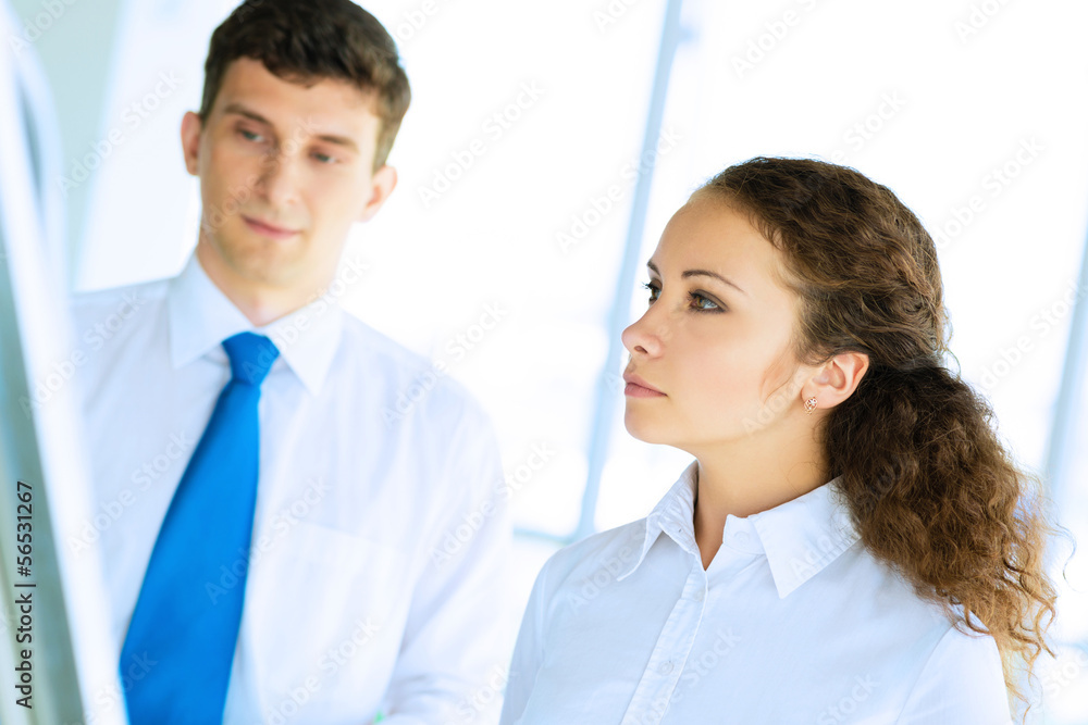 businessmen are meeting near the flipchart