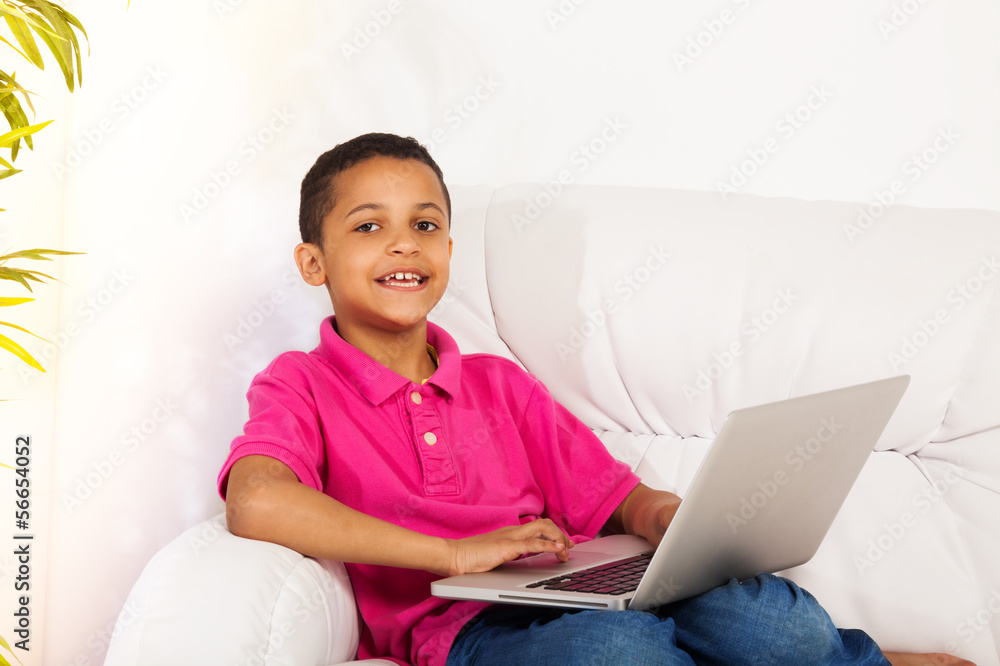 Smart boy with laptop