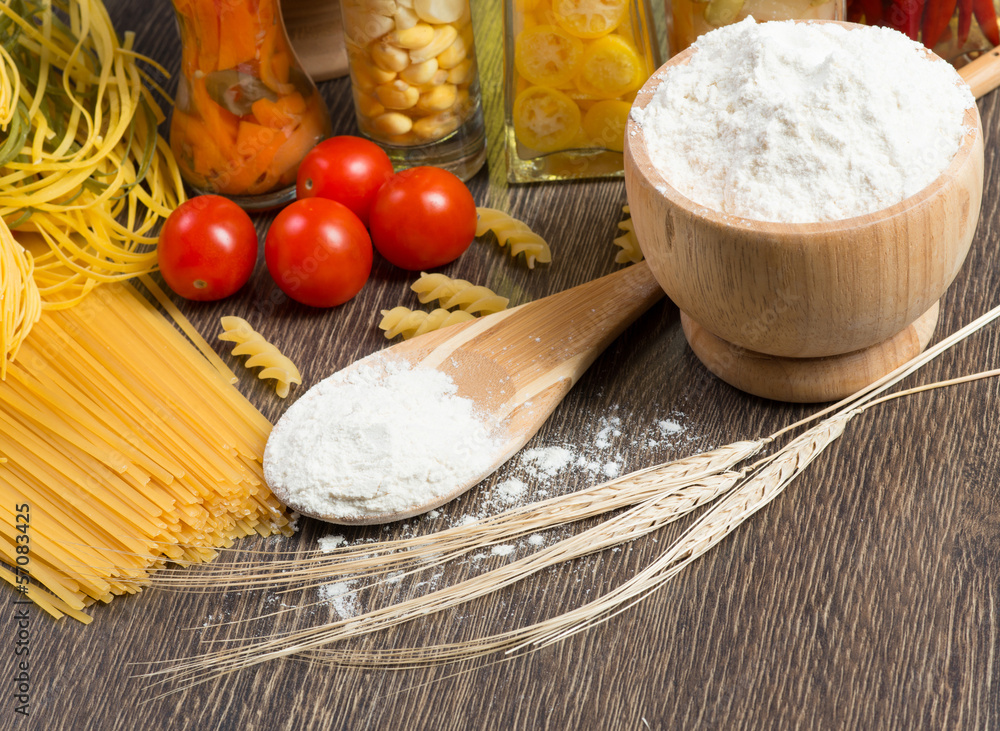 pasta, tomatoes and flour on the spoon