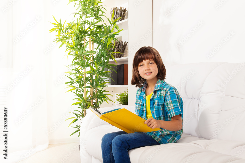 Little boy sit with book and reading