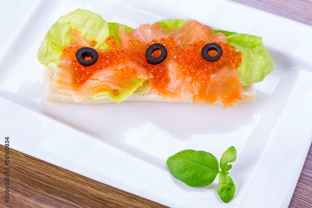 Red caviar and smoked salmon sandwich