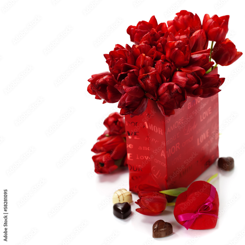 Valentine composition with shopping bag and red tulips