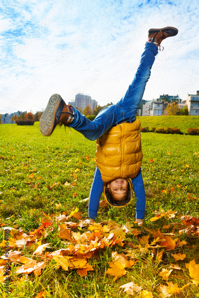 Boy standing on hands