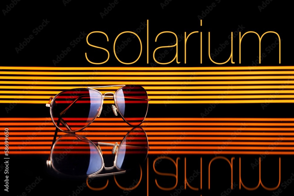 Solarium and sunglasses poster colorful lines black background