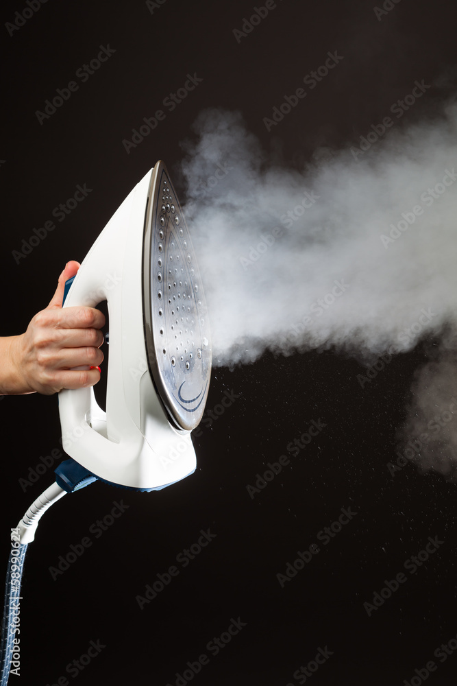 hand holding steam generator iron