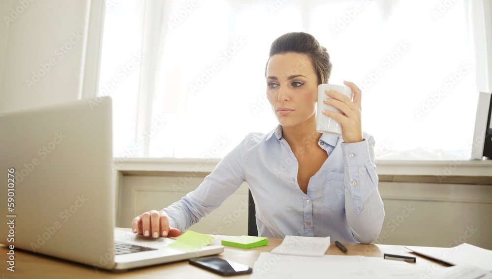 Beautiful young woman working in home office