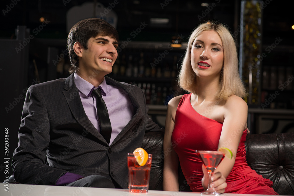 Young couple talking in a nightclub