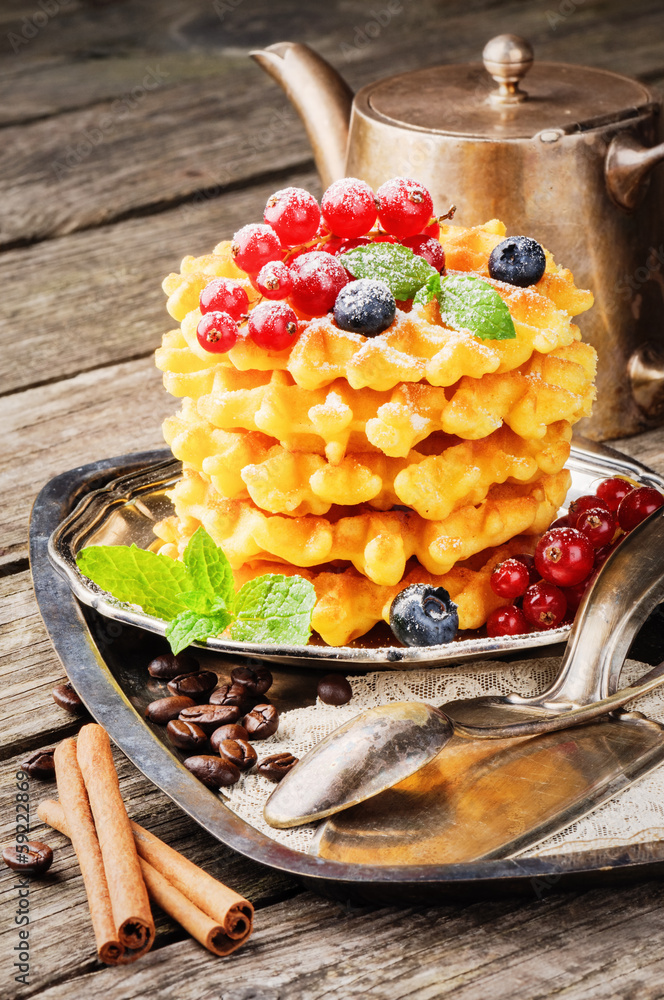 Waffles with fresh berries and coffee