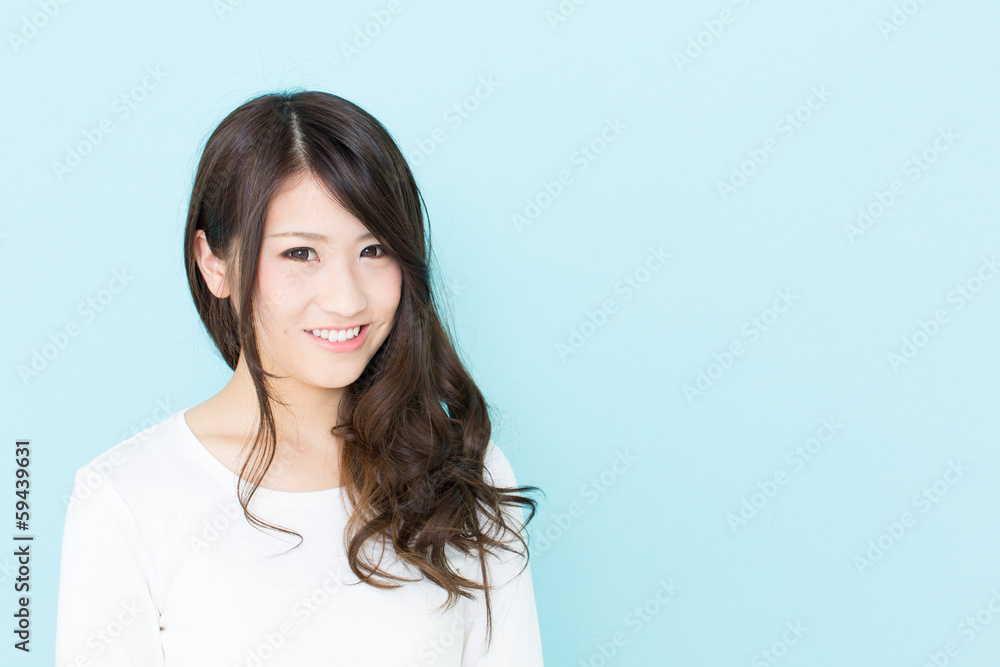 attractive asian woman on blue background