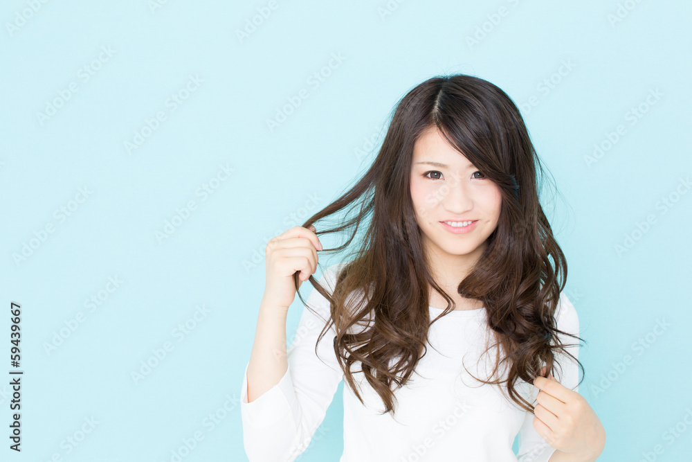 attractive asian woman on blue background