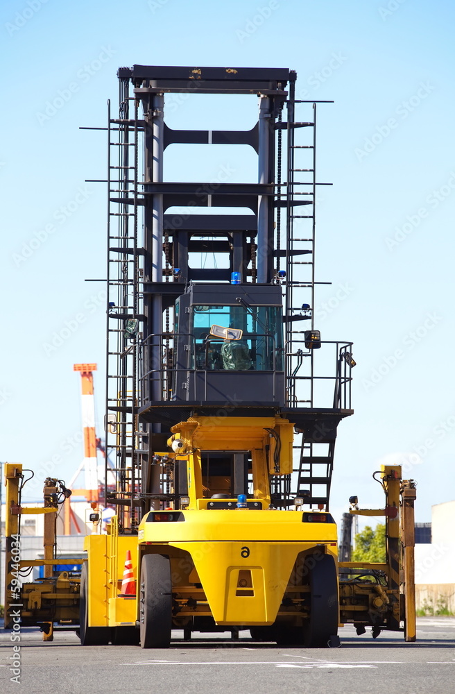 Forklift is stacking container