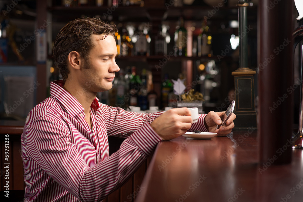 man with a cup of coffee