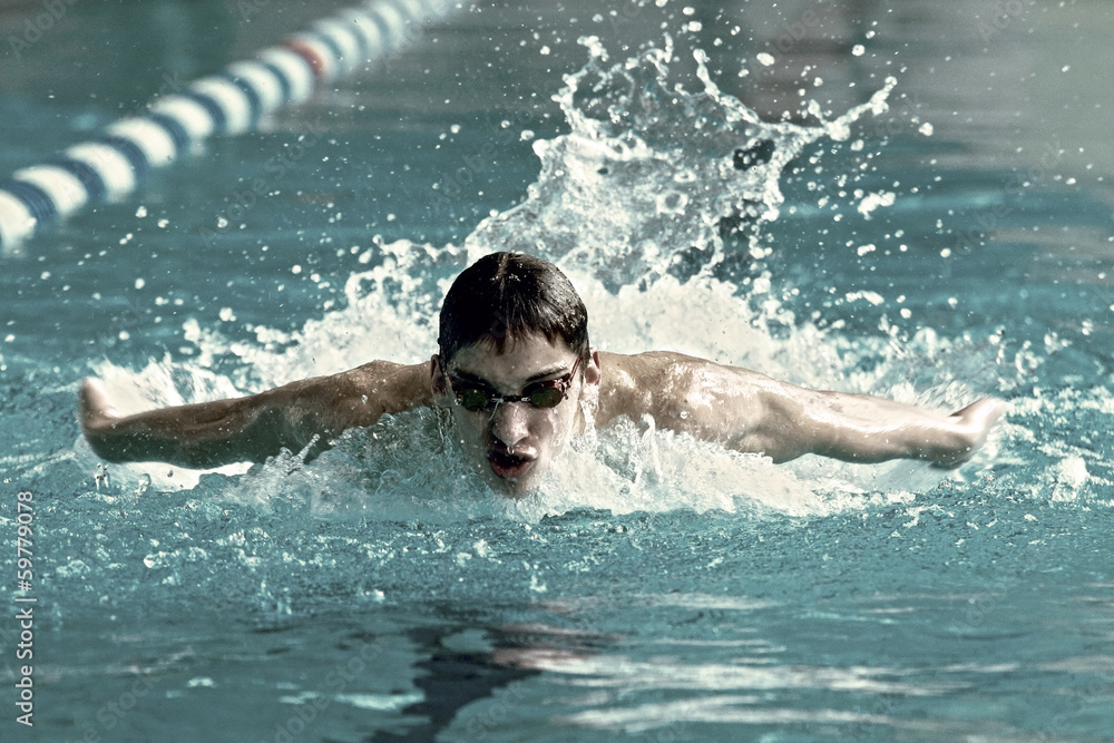 Swimmer in waterpool swim one of swimming style