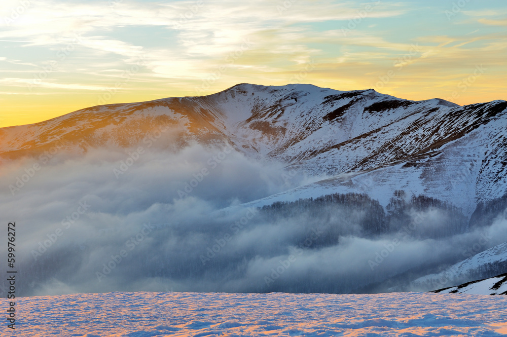 Beautiful sunset in winter mountain