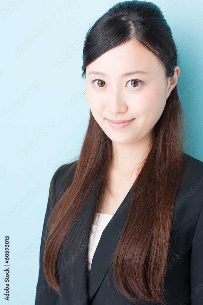 young asian businesswoman on blue background