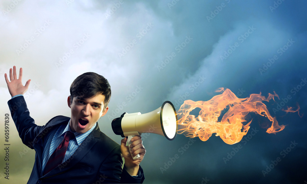 businessman shouting into a megaphone