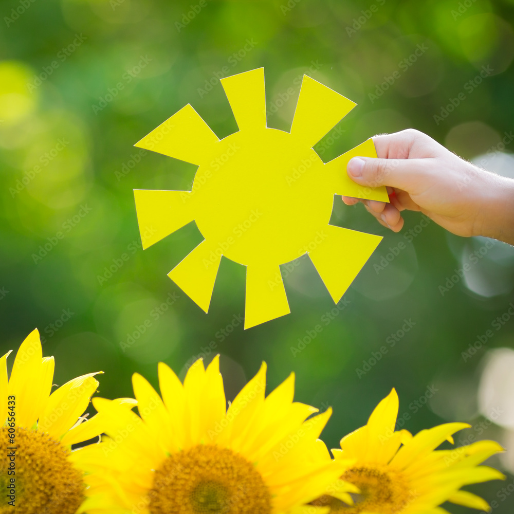 Kid holding paper sun