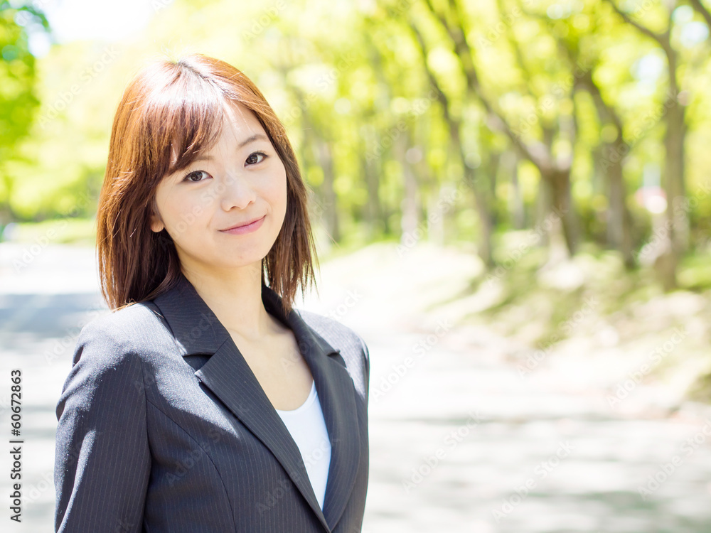 young asisn businesswoman in the park