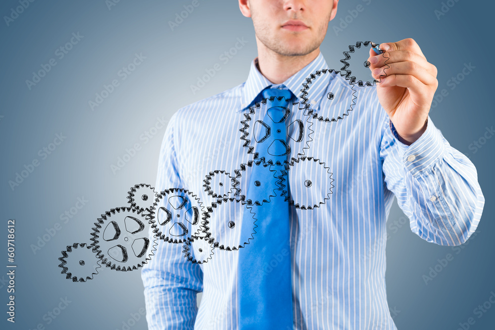 businessman drawing a sketch of the mechanism