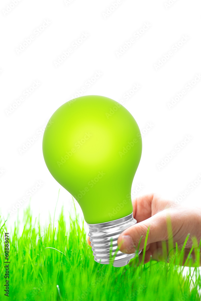 Green light bulb in hand