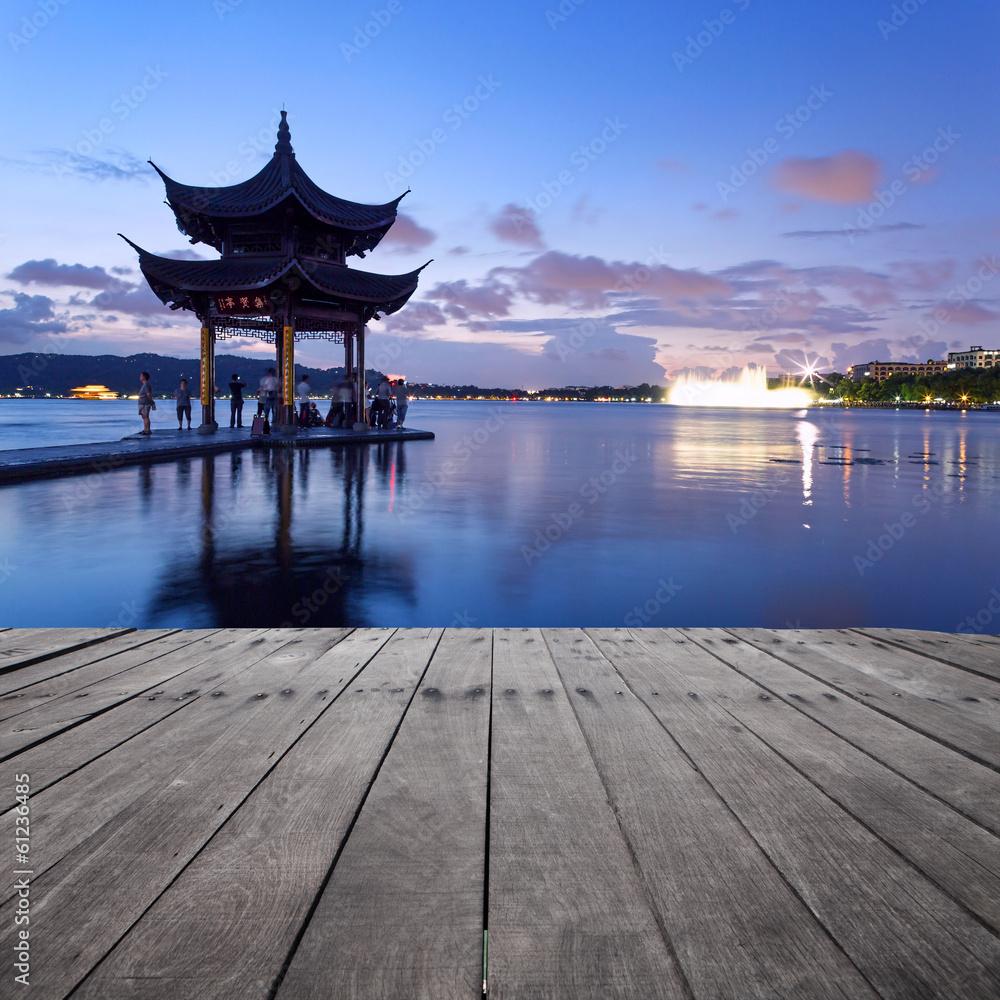 pavilion at nightfall in west lake ，hangzhou ，China