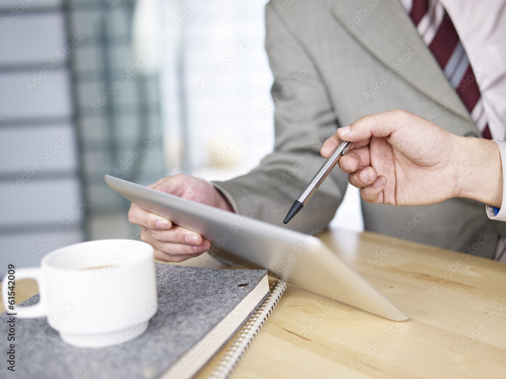 business persons using tablet in office