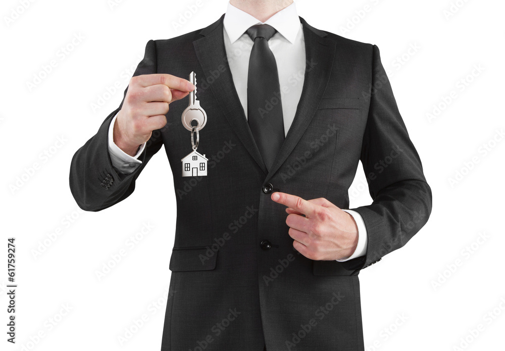 businessman gives a key