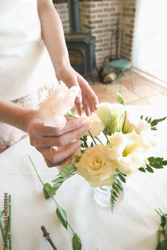 woman arranging flowers