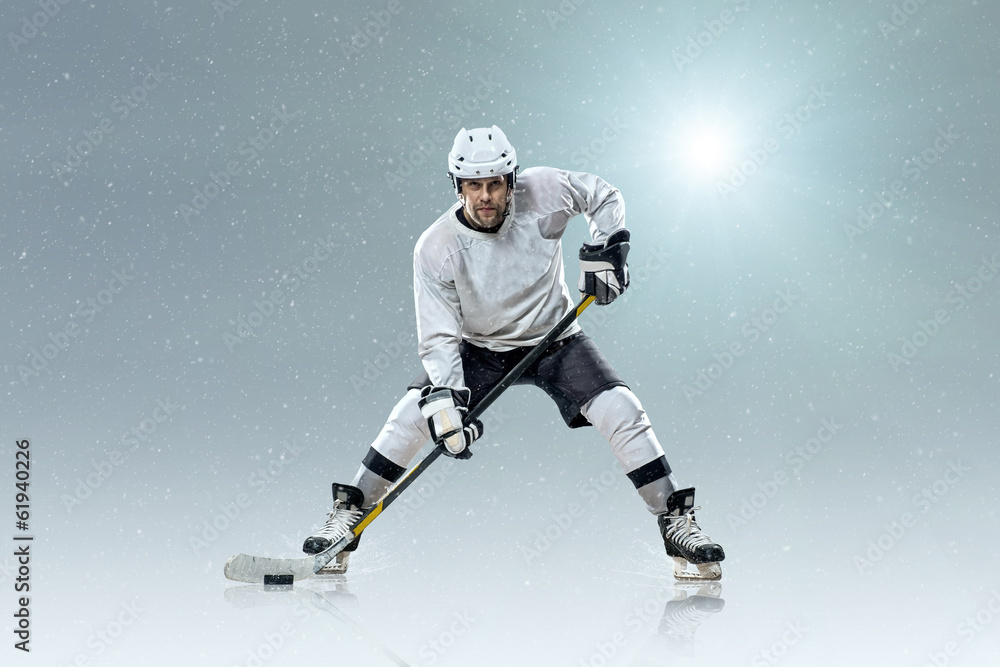 Ice hockey player on the ice and light effects