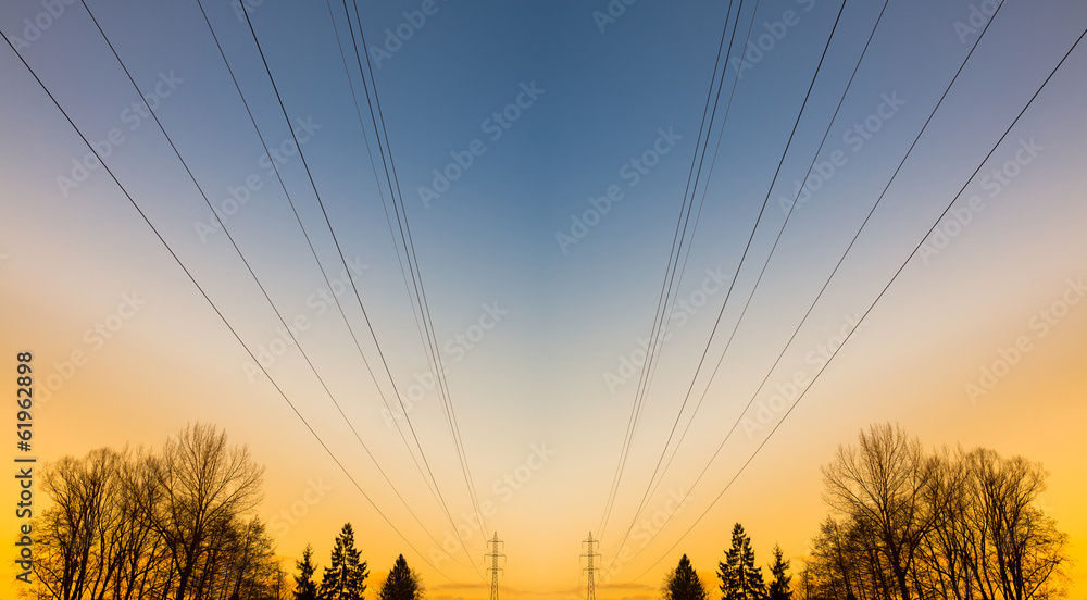 Electric power lines at sunset