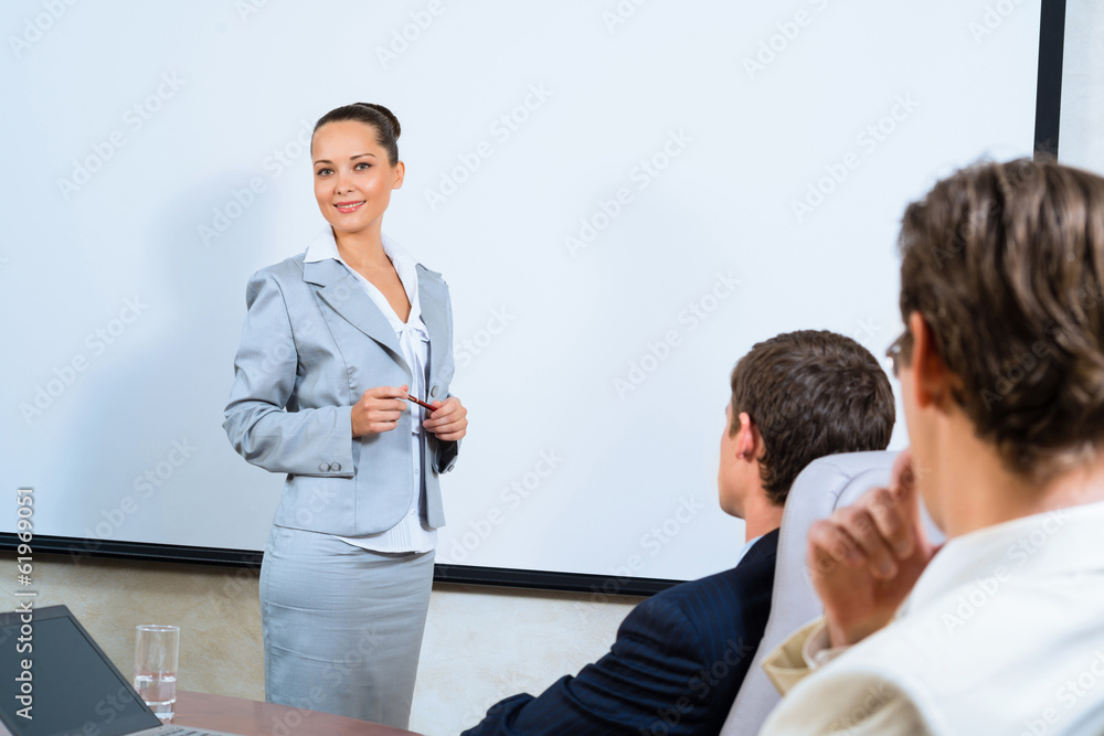 discusses business woman with colleagues