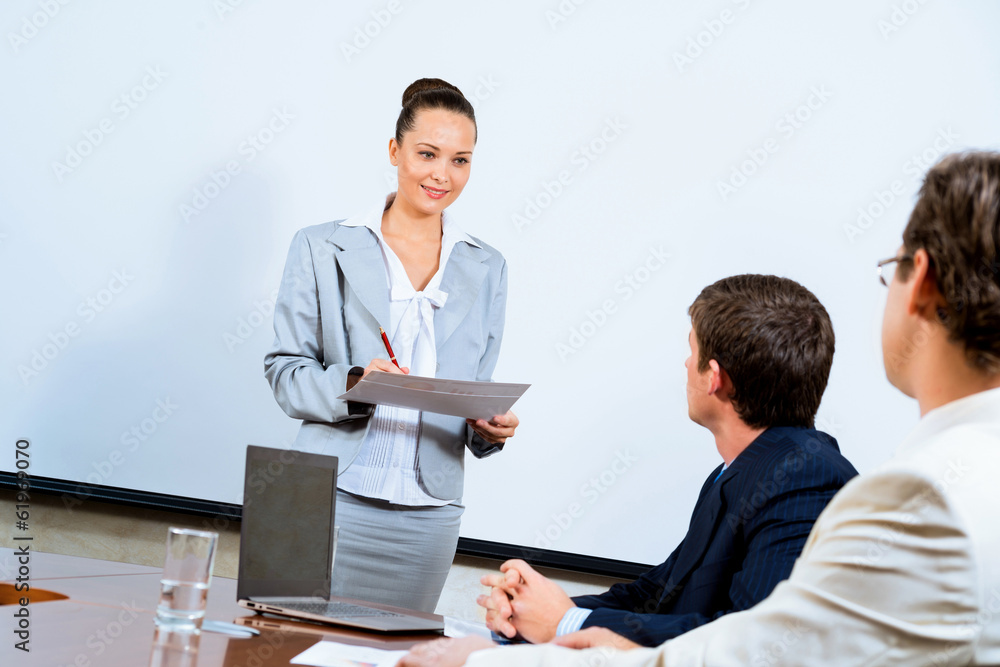 discusses business woman with colleagues