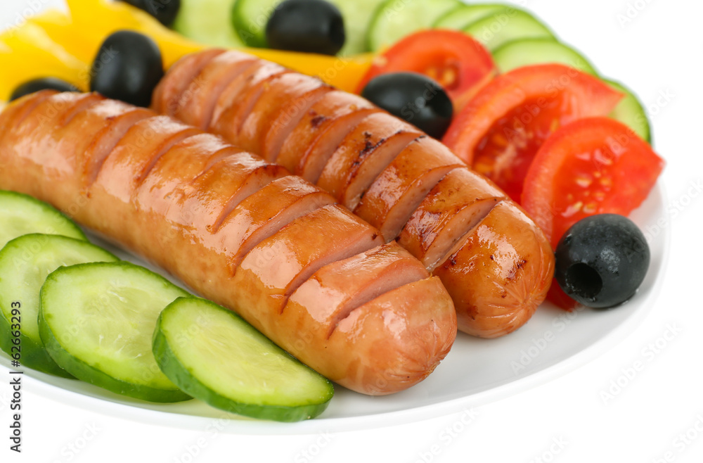 Grilled sausages with vegetables close up