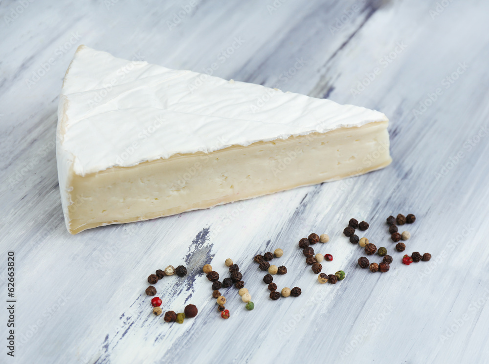 Tasty Italian cheese on wooden table