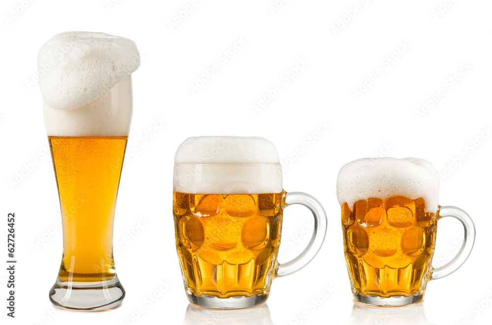 Collection of glasses of beer on white