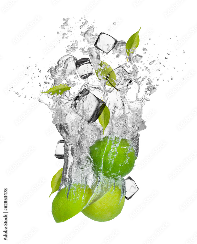 Fresh limes falling in water splash