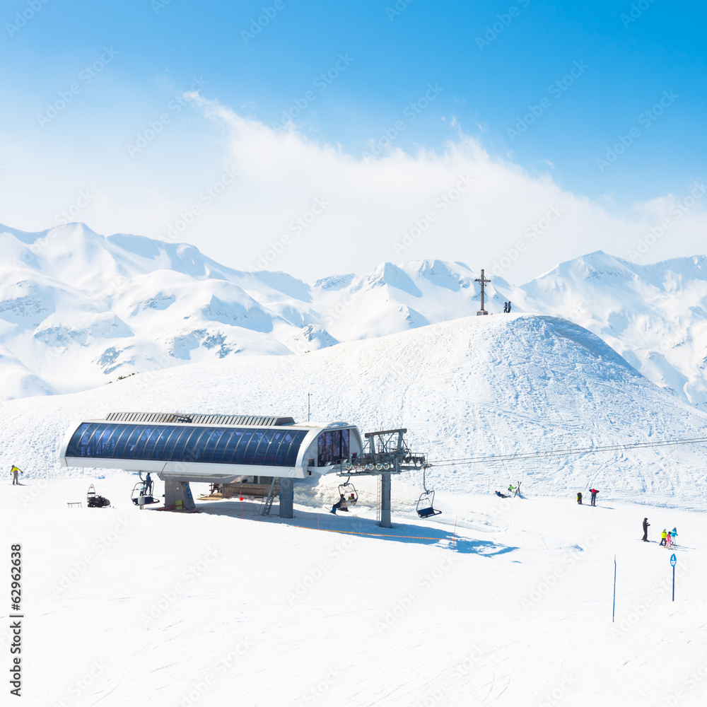 Skiers on ski lift on Vogel, Slovenia.