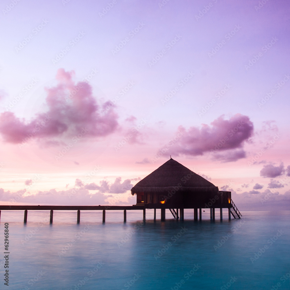 Over water bungalows with steps into amazing green lagoon