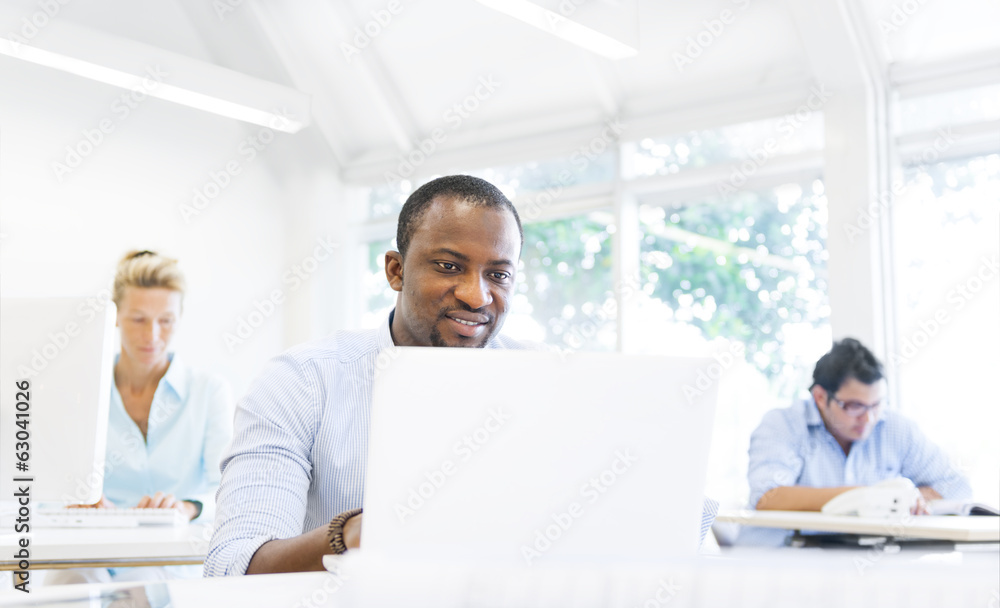 African Businessman Working On Laptop