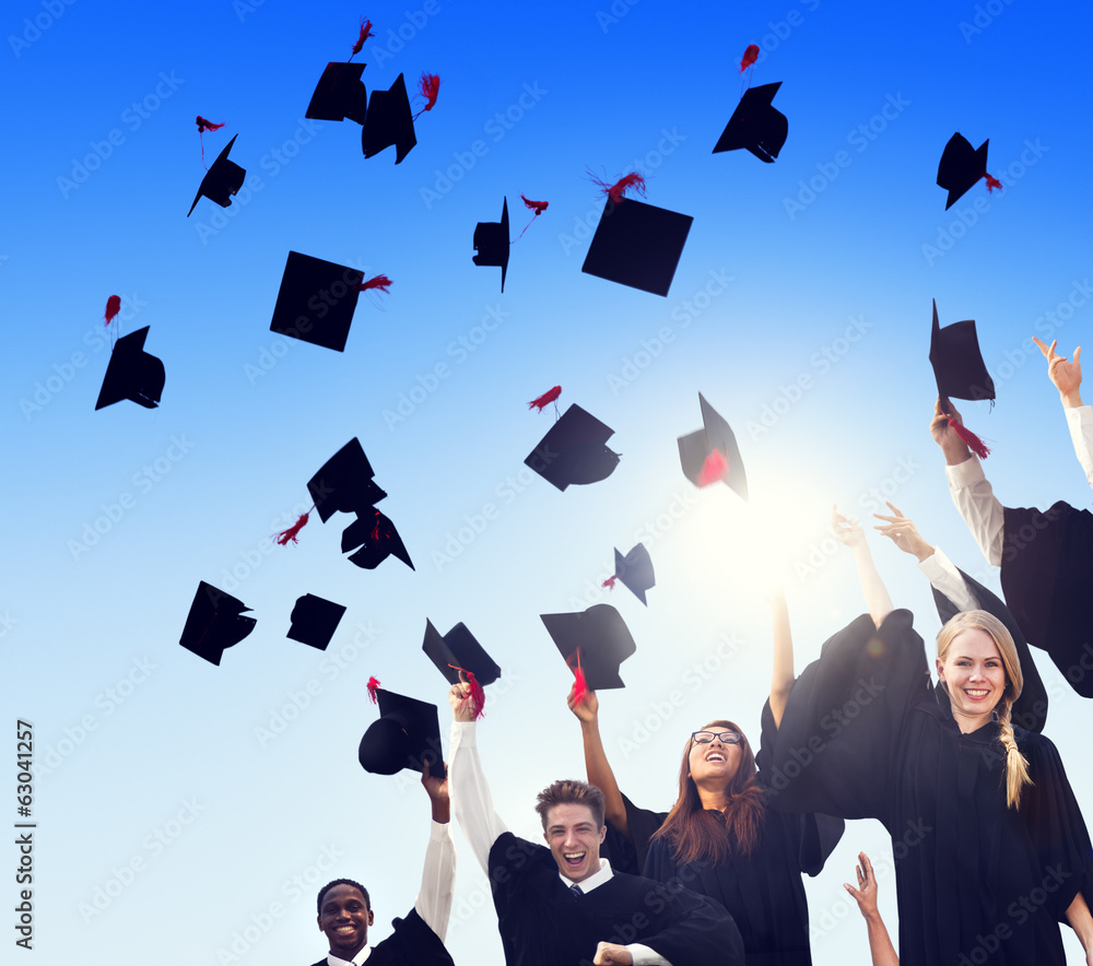 Graduating Students Celebrating And Throwing Caps In The Air