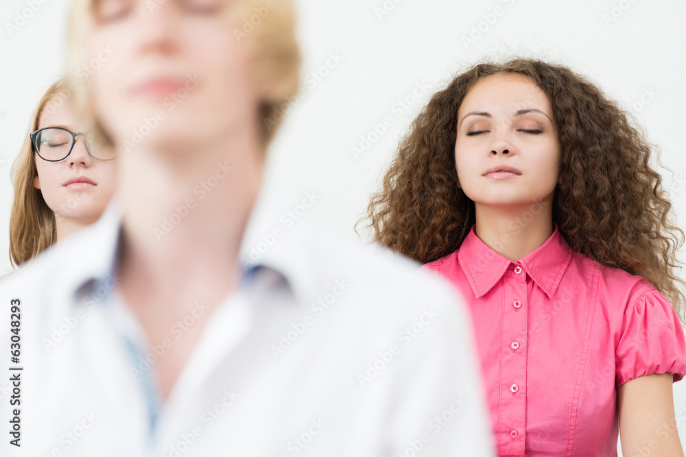 young woman, meditating with closed eyes