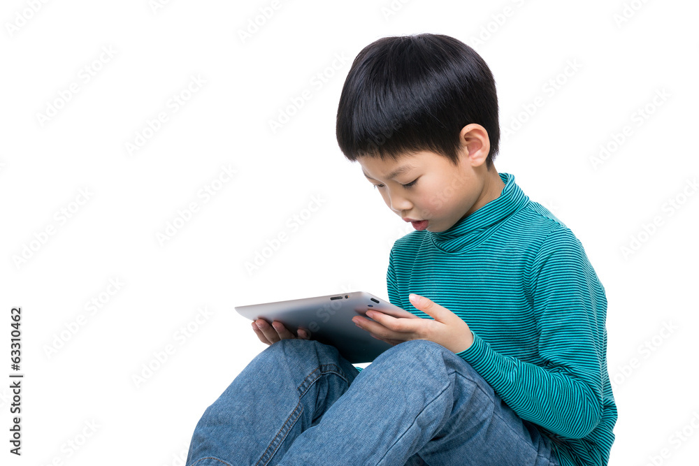 Asian little boy using tablet