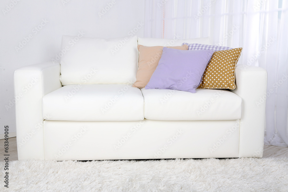 White leather sofa in room