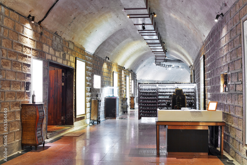 Wine cellar with wine bottle and glasses