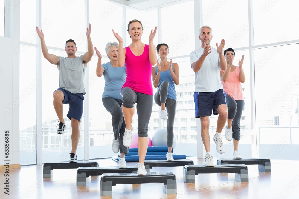 Portrait of smiling people doing power fitness exercise