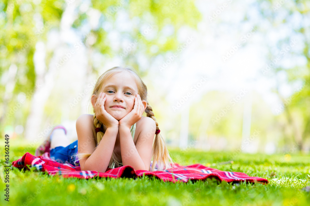 portrait of a smiling girl in a park